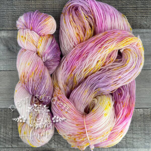 pale pink, yellow and lavender with some yellow speckles hand dyed yarn