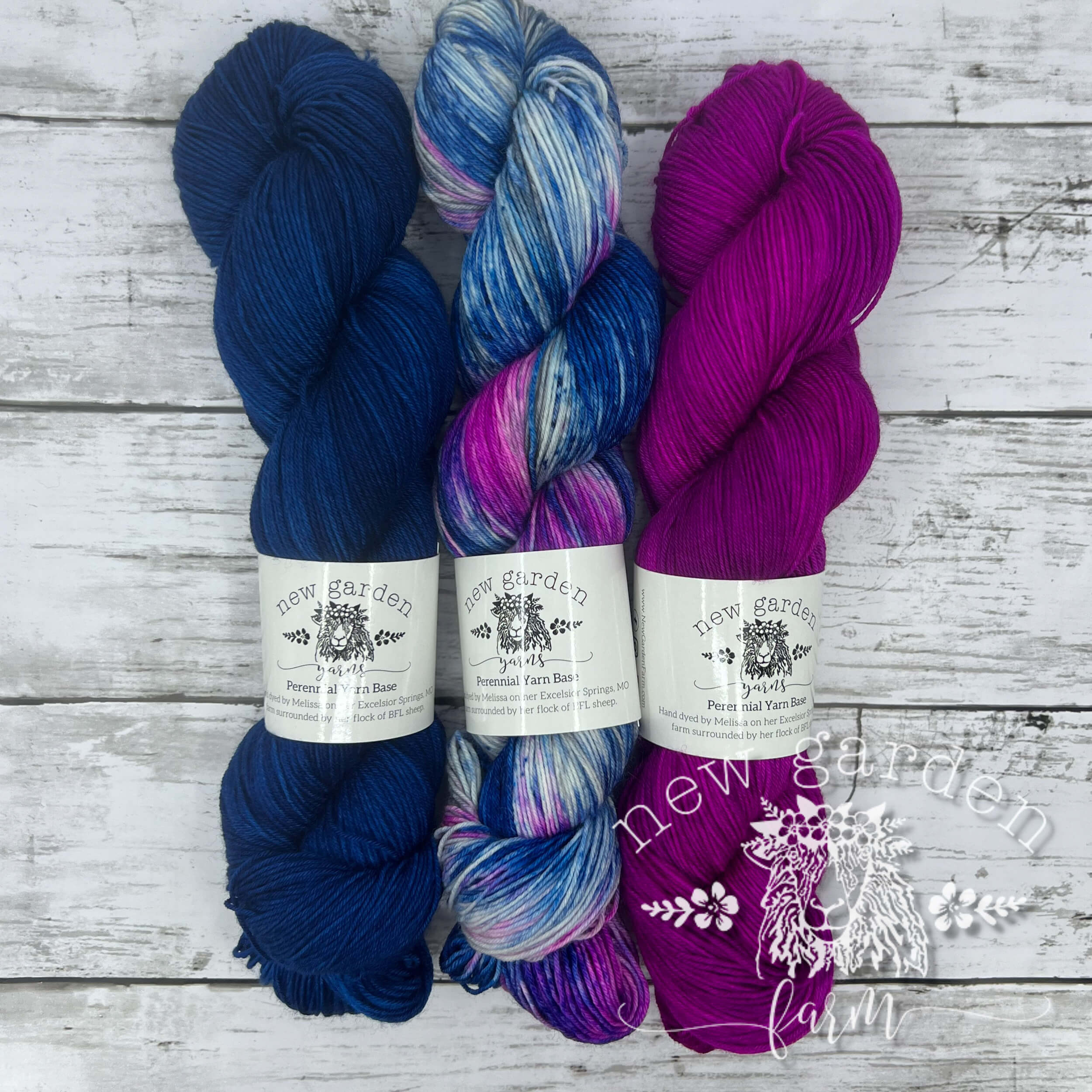 trio of coordinating hand dyed yarn, blue pink and combo of blue ink and grey