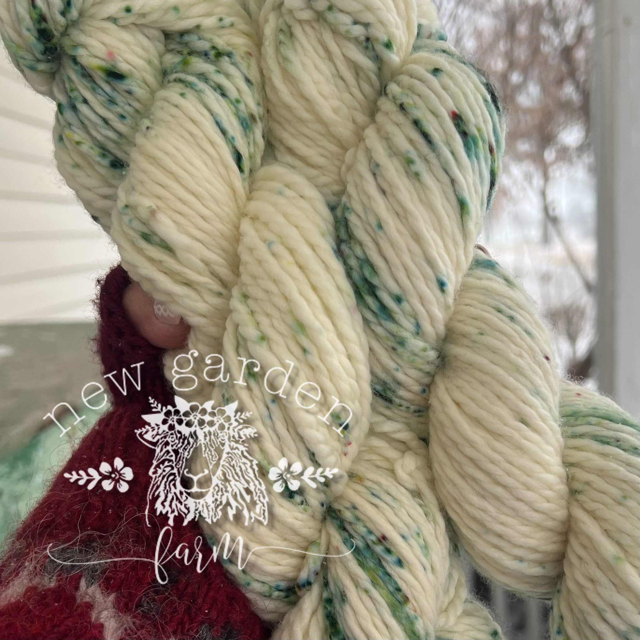 Creamy natural white with green speckles hand dyed yarn for knitting or crochet